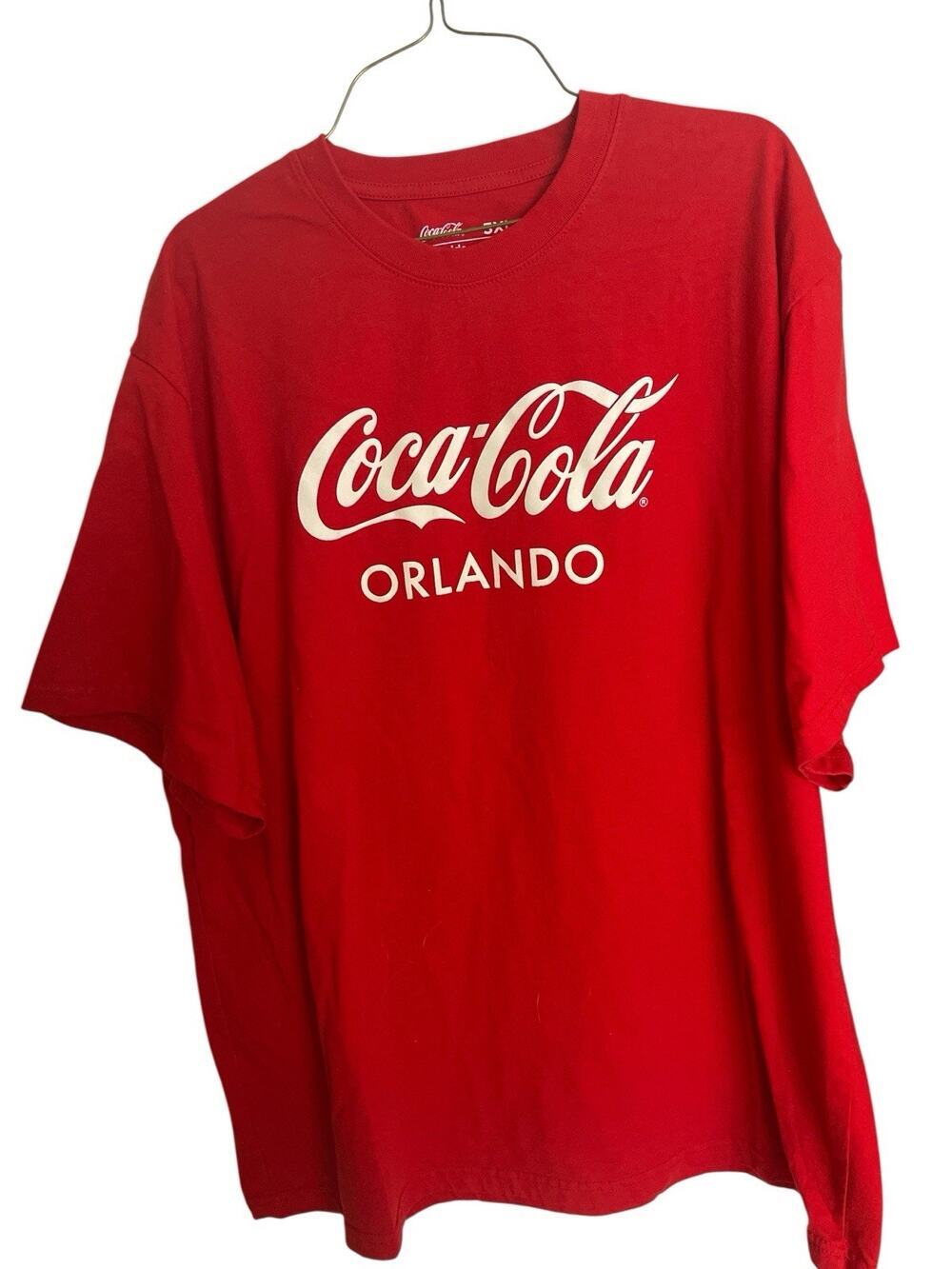 COCA COLA SIZE 3XL RED TEE WITH COCA COLA ORANDO ON FRONT WITH WHITE LETTER